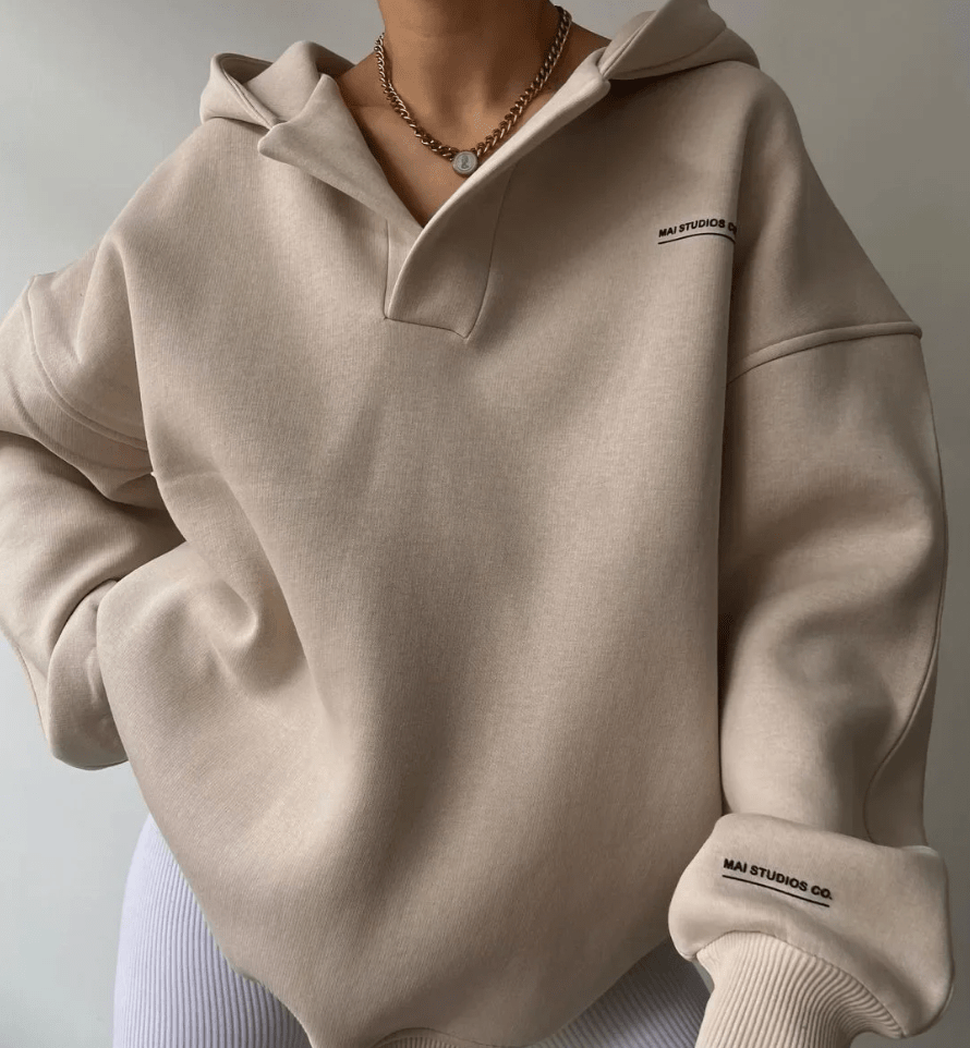Women's oversized pullover hoodie with stylish notch neck and drop shoulders.