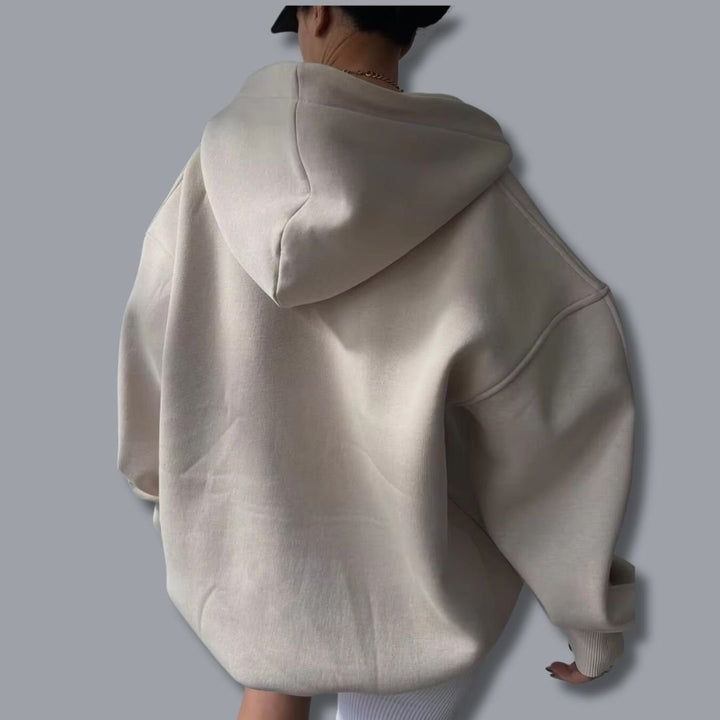 Super cozy women's oversized pullover hoodie. Comfort wear with a fashionable notch neck detail.