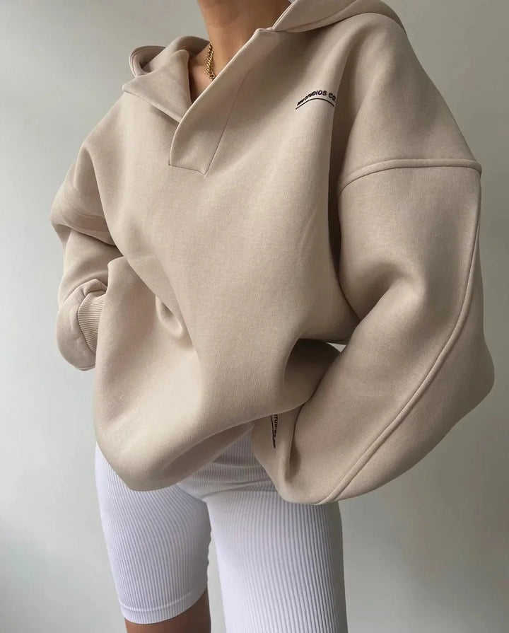 Fashionable women's oversized hoodie. Cozy drop-shoulder pullover with a chic notch neck.