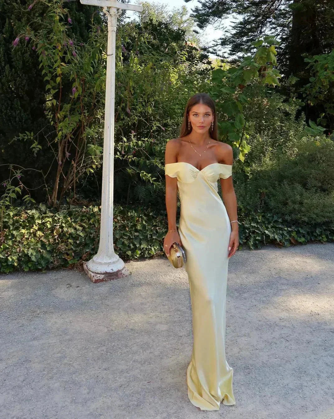 Flowy yellow off-shoulder maxi dress for women, elegant summer party or formal occasion wear.