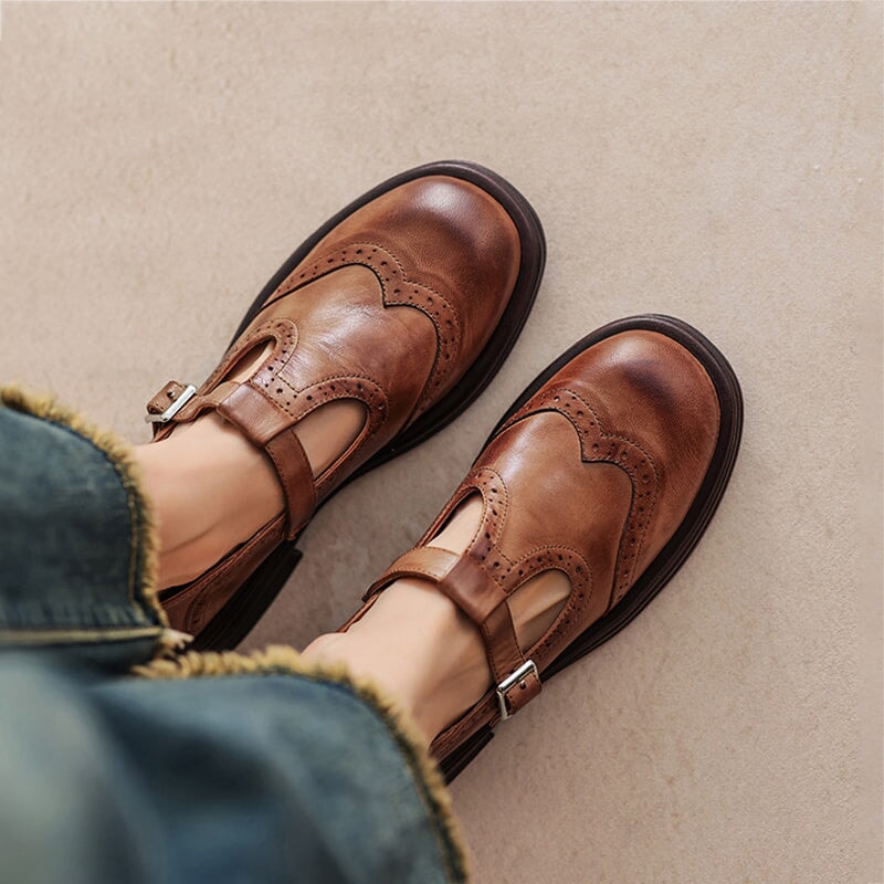Classic women's Mary Jane shoes in black with a comfortable buckle strap, closed toe, and flat sole.