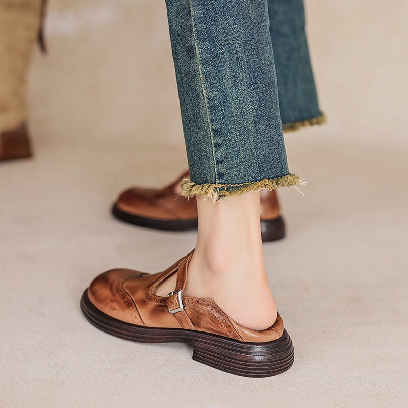 Women's classic black Mary Jane shoes, comfortable flat sole, stylish buckle strap closure for casual footwear.