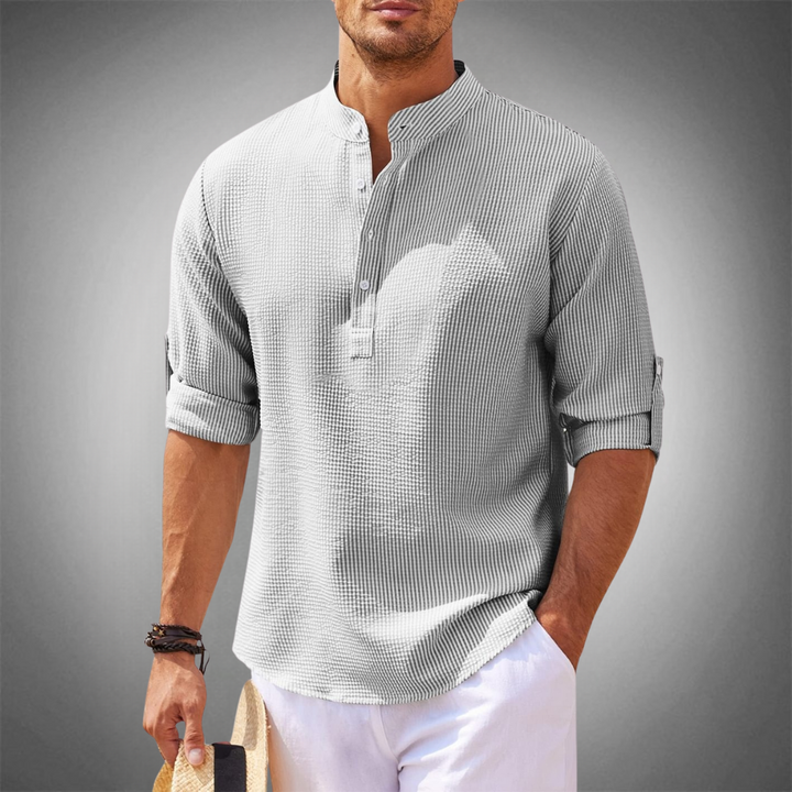 Men's tailored fit button-down shirt in a classic long-sleeve design, ideal for spring fashion and smart summer style.
