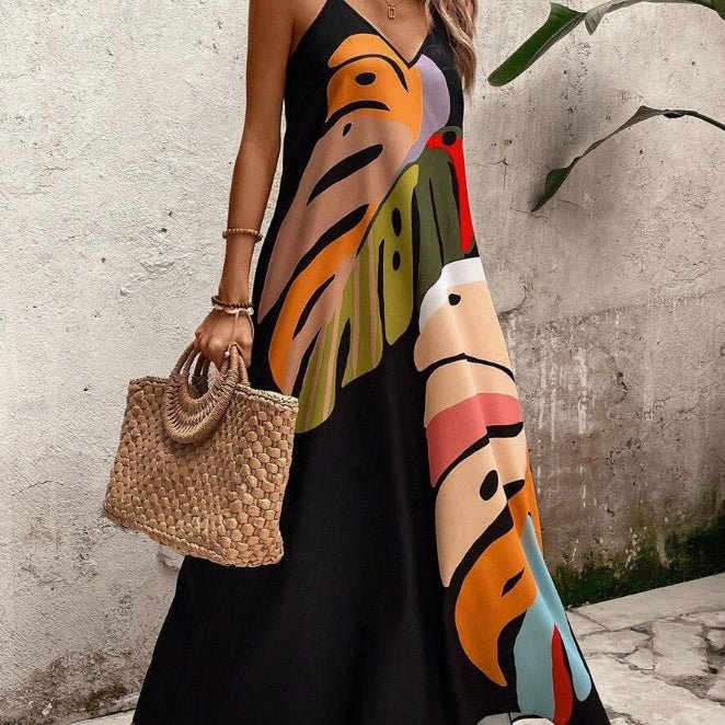 Women's tropical leaf print V-neck sleeveless maxi dress, perfect for summer beach vacations, flowy & elegant.