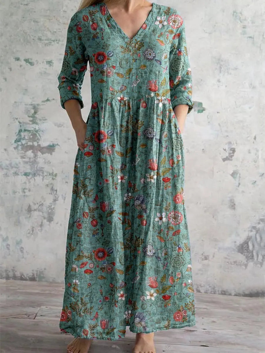 Elegant women's V-neck floral maxi dress with practical side pockets, perfect for versatile autumn and winter wear.