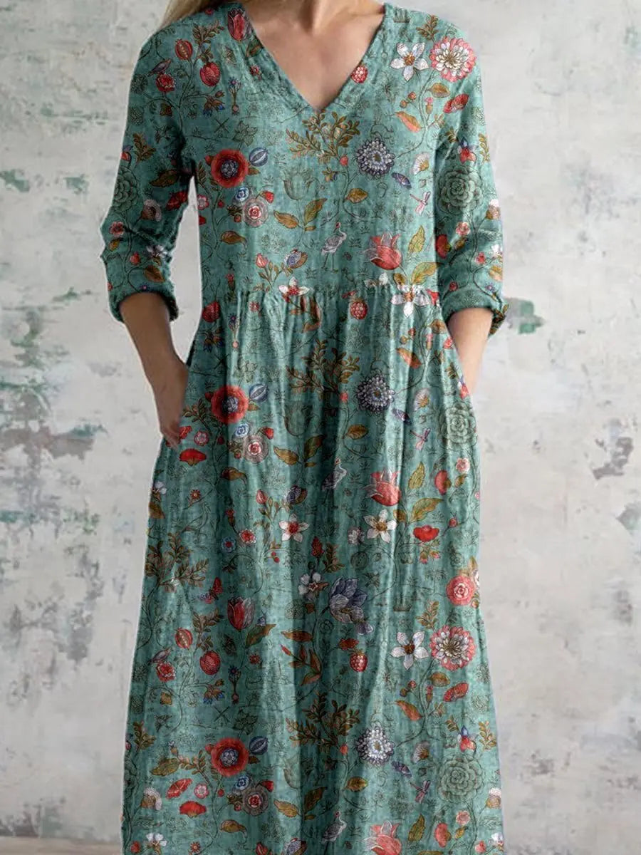 Comfortable bohemian floral V-neck maxi dress for women, featuring convenient side pockets for casual elegance.