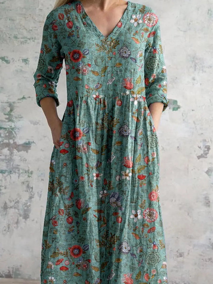 Comfortable bohemian floral V-neck maxi dress for women, featuring convenient side pockets for casual elegance.