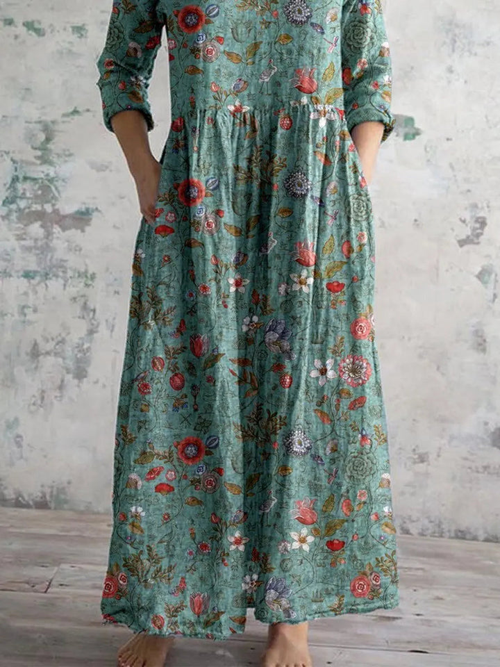 Long floral print V-neck maxi dress for women with side pockets, ideal for versatile casual or elegant autumn outfits.