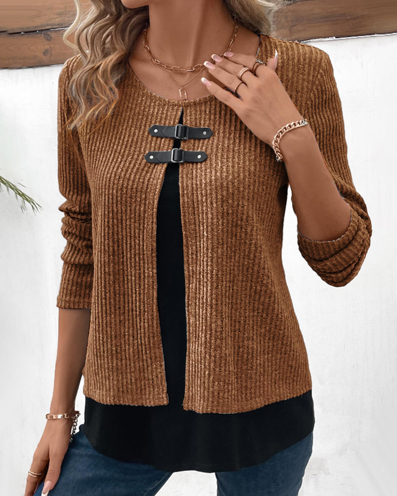 Relaxed fit women's top featuring a round neck, layered long sleeves, and chic color block patchwork.