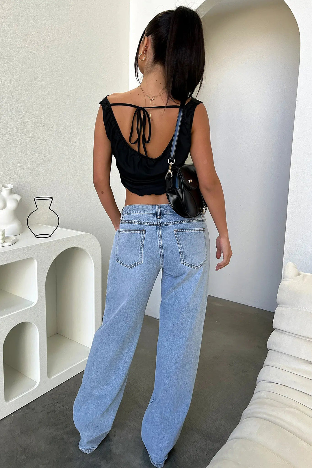 Relaxed fit women's low-rise baggy straight jeans in light blue wash. Versatile casual denim for trendy Y2K outfits.