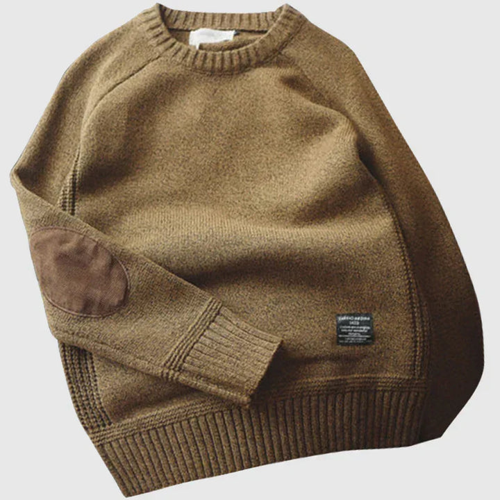 Close-up of men's alpine knit sweater, showing soft texture & cozy style for warm winter clothing.