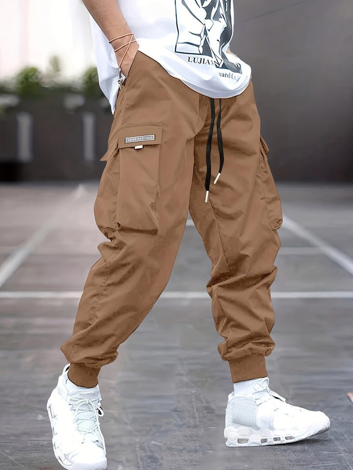 Men's relaxed fit cargo pants, perfect for utility & casual wear, with an adjustable drawstring and spacious pockets.