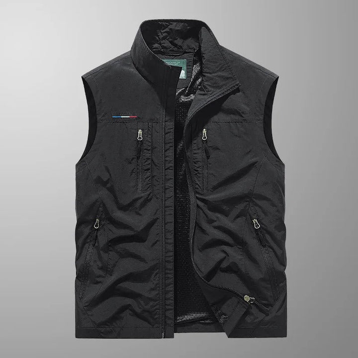 Multi-pocket men's cargo vest. Breathable, lightweight outdoor gear for hiking, fishing, and travel adventures.