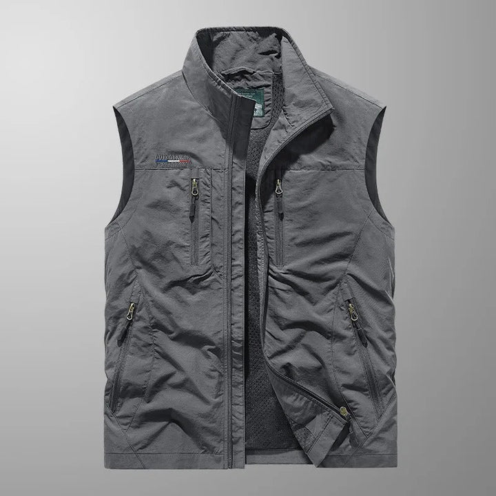 Men's adventure cargo vest. Breathable utility vest for fishing, hiking & travel. Lightweight, multi-pocket design.