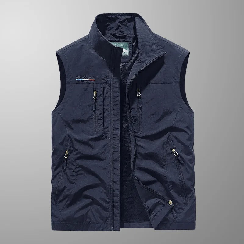Man wearing a breathable multi-pocket cargo vest for outdoor adventure. Ideal for hiking, fishing, and travel.