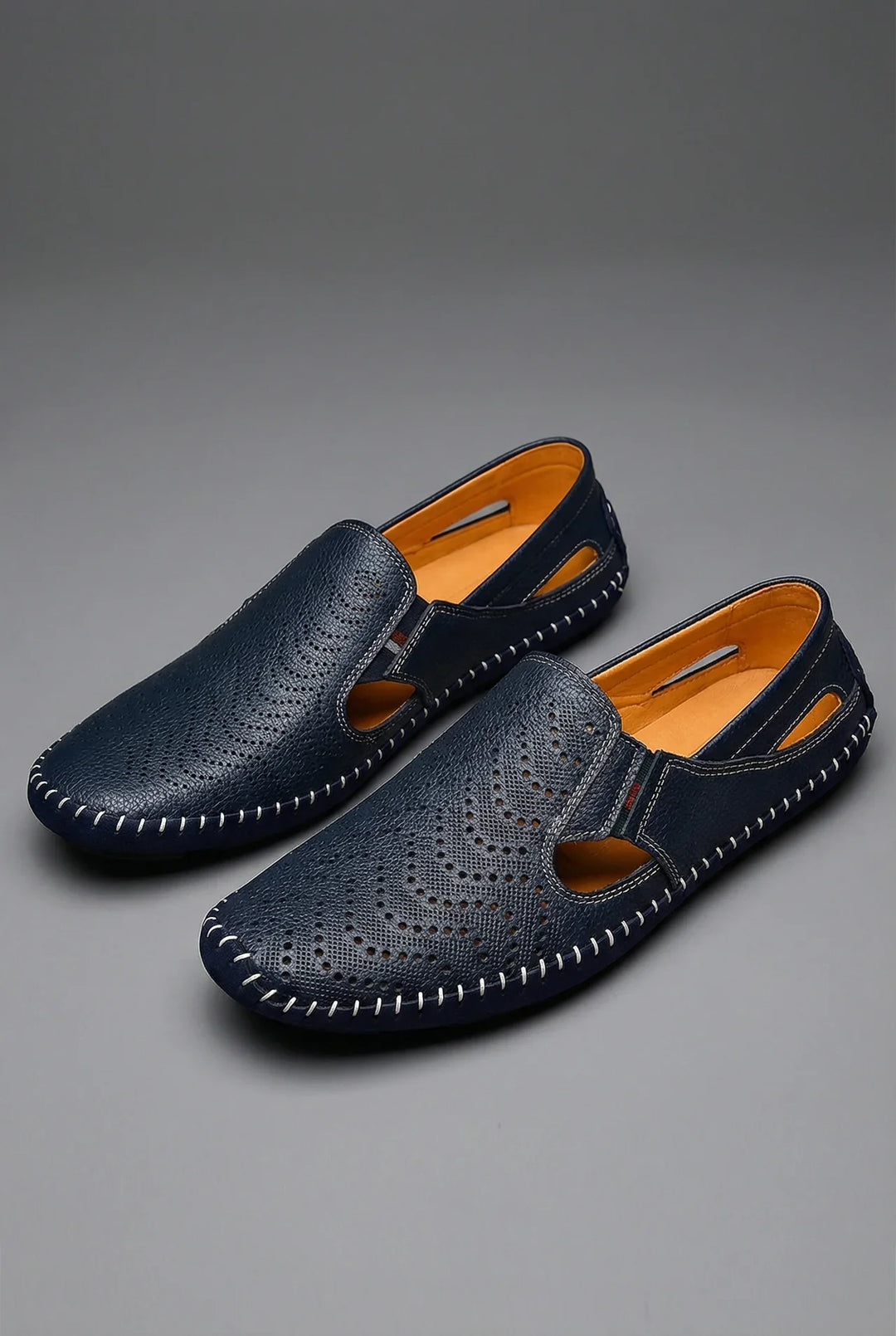 Stylish men's slip-on loafers with breathable textile upper. Perfect for summer casual wear & driving comfort.