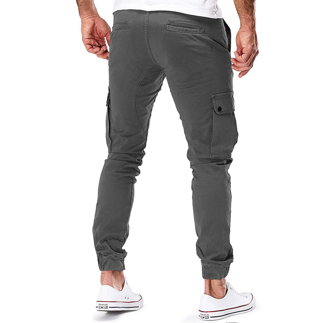 Durable men's cargo pants, close-up of side pockets, ideal for outdoor adventures & practical utility.