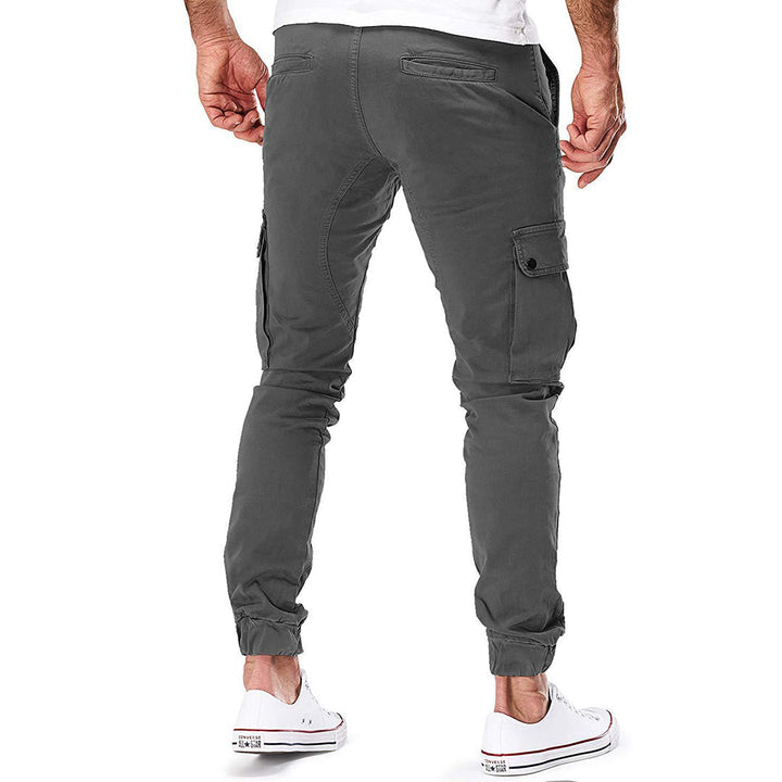 Durable men's cargo pants, close-up of side pockets, ideal for outdoor adventures & practical utility.