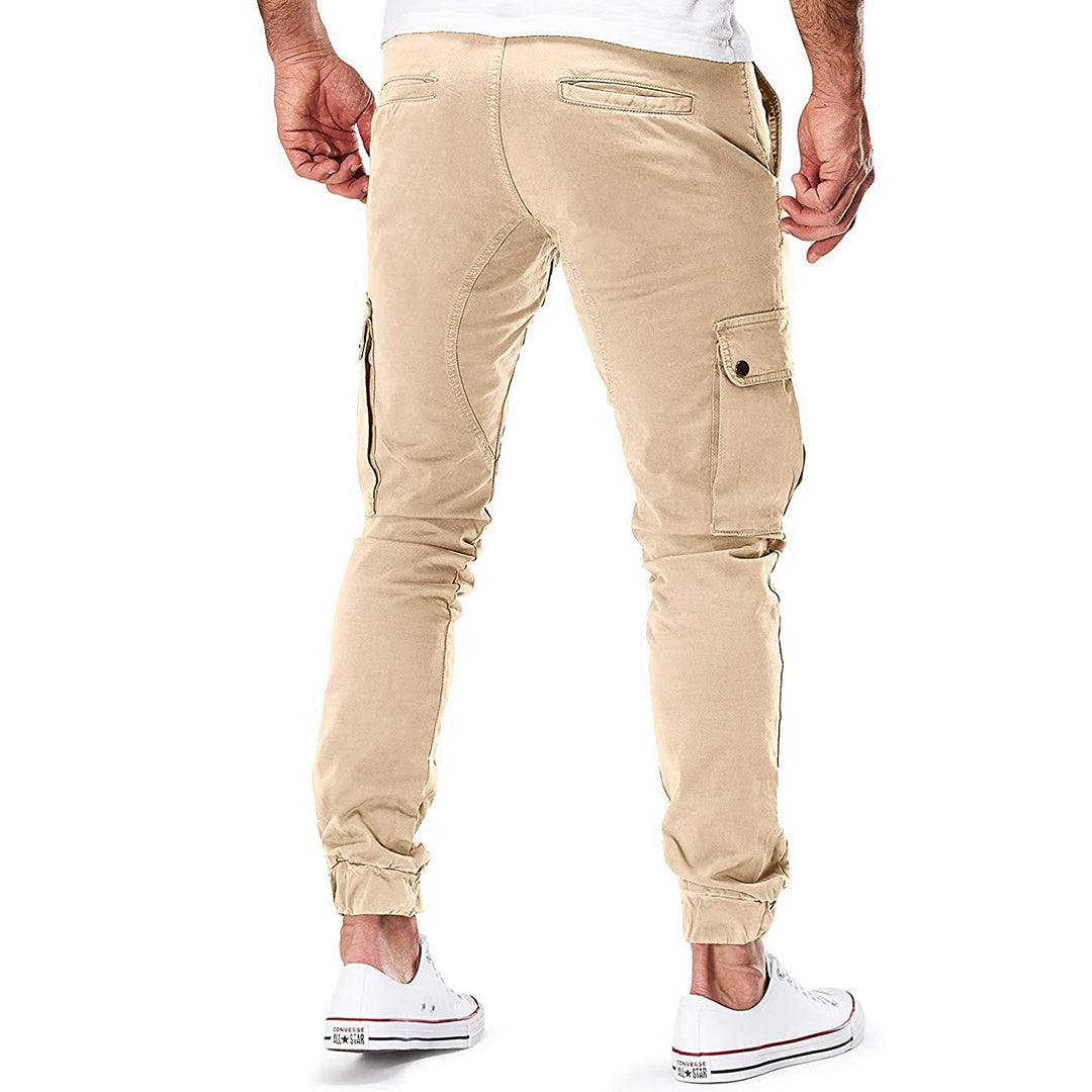 Stylish men's cargo pants, dark color, for casual fashion & practical everyday use with many pockets.