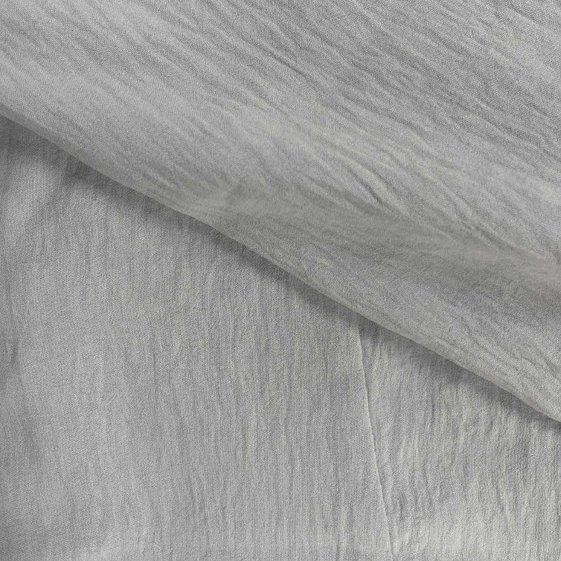 Close-up of a men's casual button-front shirt, long-sleeve for summer, showing relaxed fit and versatile style.