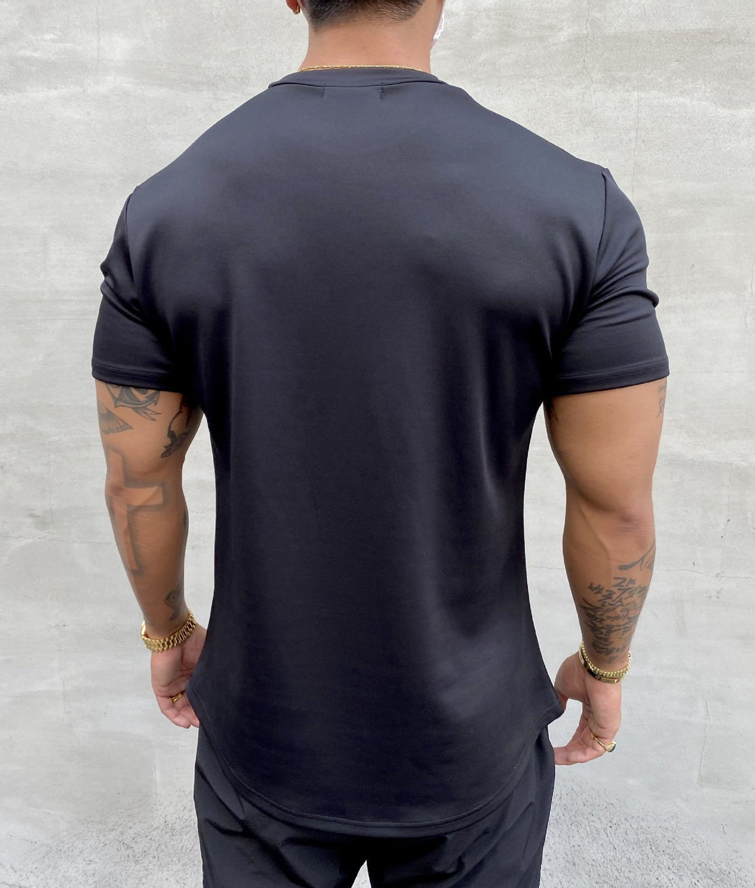Man wearing a comfortable & stylish men's casual short-sleeve t-shirt for daily activities.