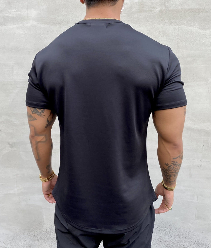 Man wearing a comfortable & stylish men's casual short-sleeve t-shirt for daily activities.