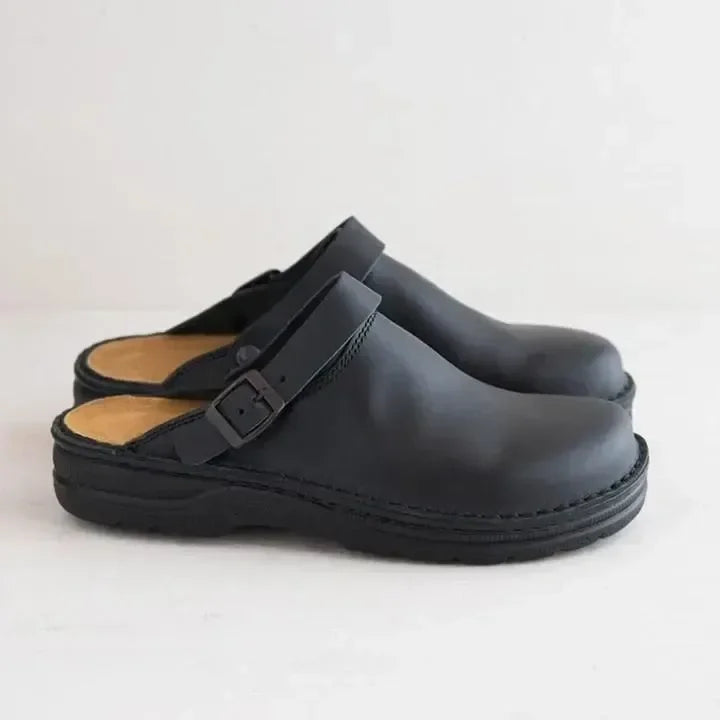 Front view of men's casual slip-on clog mules featuring an adjustable buckle. Ideal comfortable house shoes.