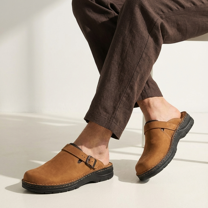 Close-up of the adjustable buckle on men's casual slip-on clog mules, highlighting style and fit.