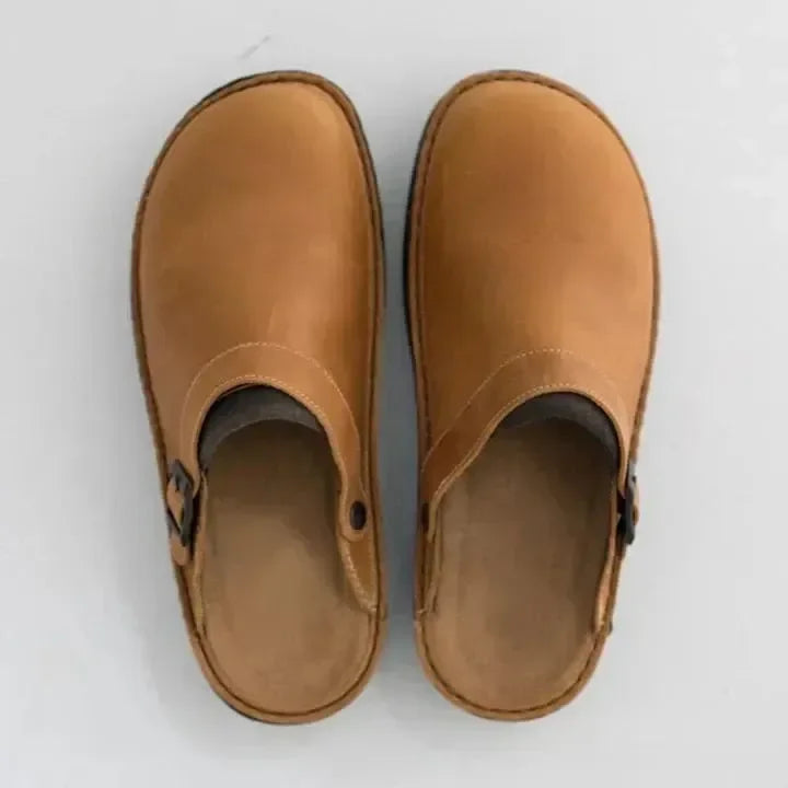 Versatile men's casual slip-on clog mules with an adjustable buckle. Great comfortable house shoes for men.