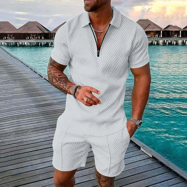 Comfortable men's two-piece summer set: stylish polo shirt & matching shorts for beach or casual outings.