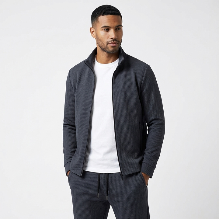 Sporty men's two-piece tracksuit featuring a zip jacket and matching joggers for casual fashion.