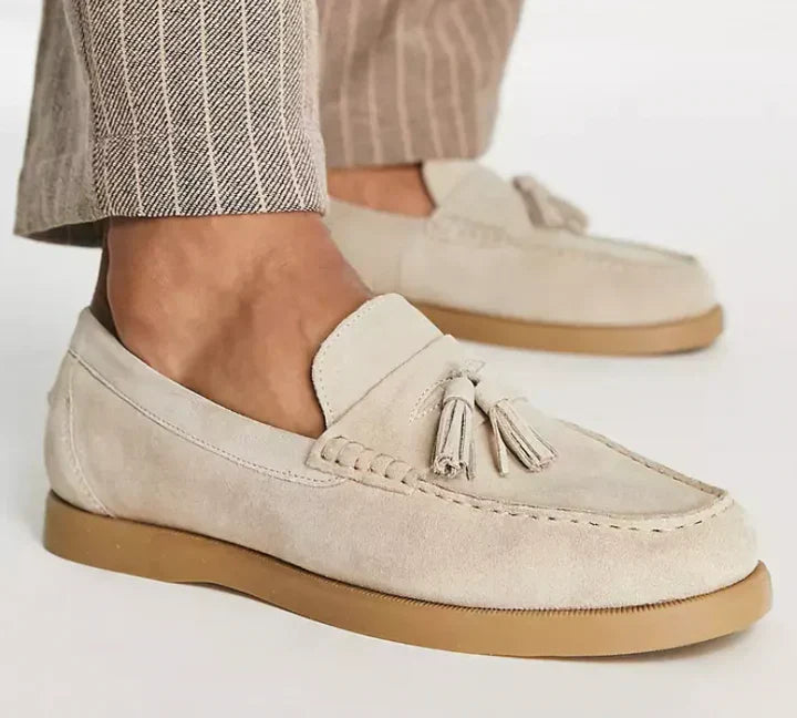 Men's classic beige slip-on loafers offering effortless style & all-day comfort for formal or casual wear.