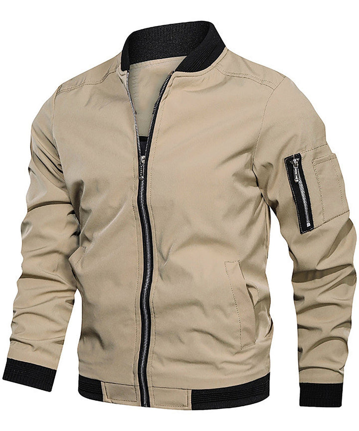 Modern men's grey bomber jacket, showcasing a distinctive sleeve zip pocket. Essential casual fashion.
