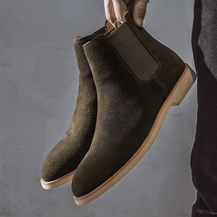 Elegant men's polished leather Chelsea boots, slip-on ankle style perfect for smart or casual occasions.