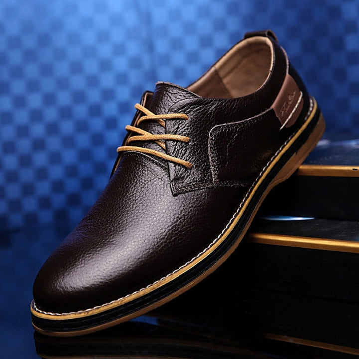 Men's classic black leather Oxford dress shoes for business or formal events, offering timeless style and comfort.