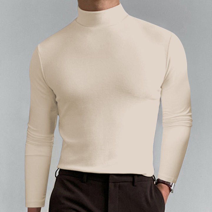 Man wearing a classic men's turtleneck sweater with jeans, showcasing a perfect casual winter look.