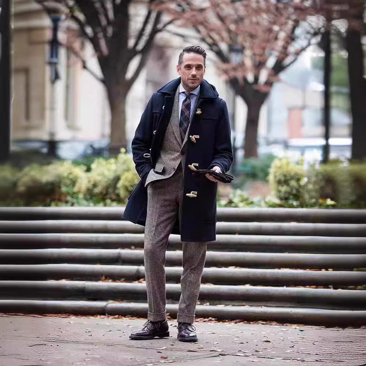 Elegant men's duffle coat in wool blend, featuring classic toggle closures & large pockets. Timeless smart casual winter jacket.