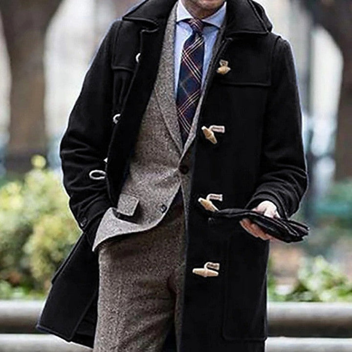Warm men's duffle coat, perfect for cold weather. Classic design with traditional toggle fasteners. Smart outerwear style.