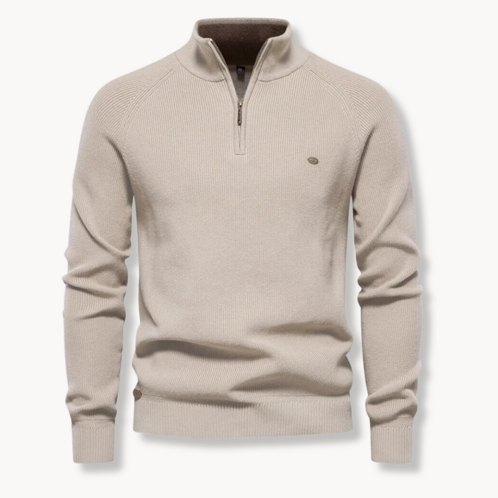 Close-up of men's ribbed half-zip sweater in a soft knit, showing texture & mockneck detail. Comfortable long-sleeve top.