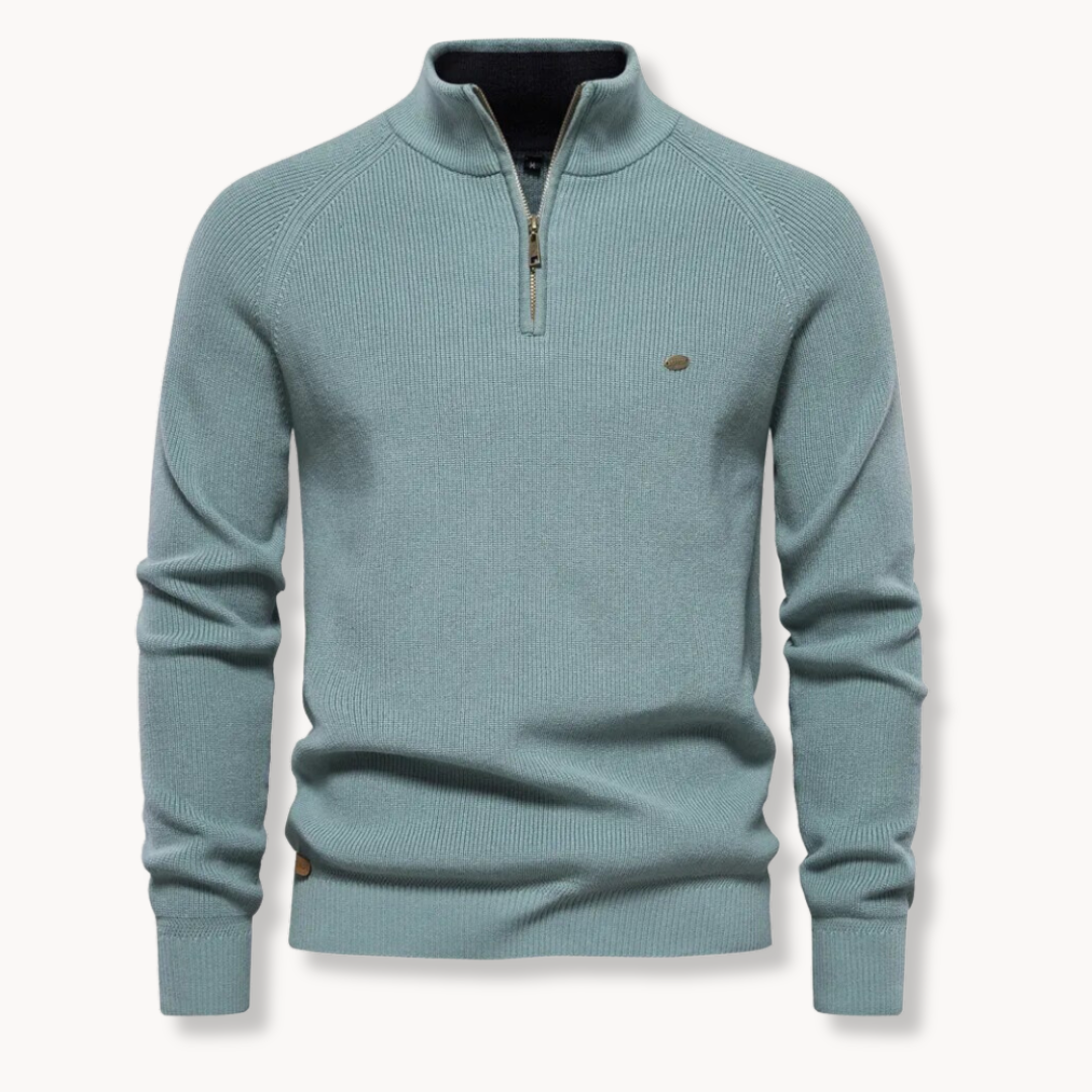 Model wearing a men's comfortable half-zip ribbed sweater in grey, showcasing its versatile fit & stylish appeal. Winter layering.