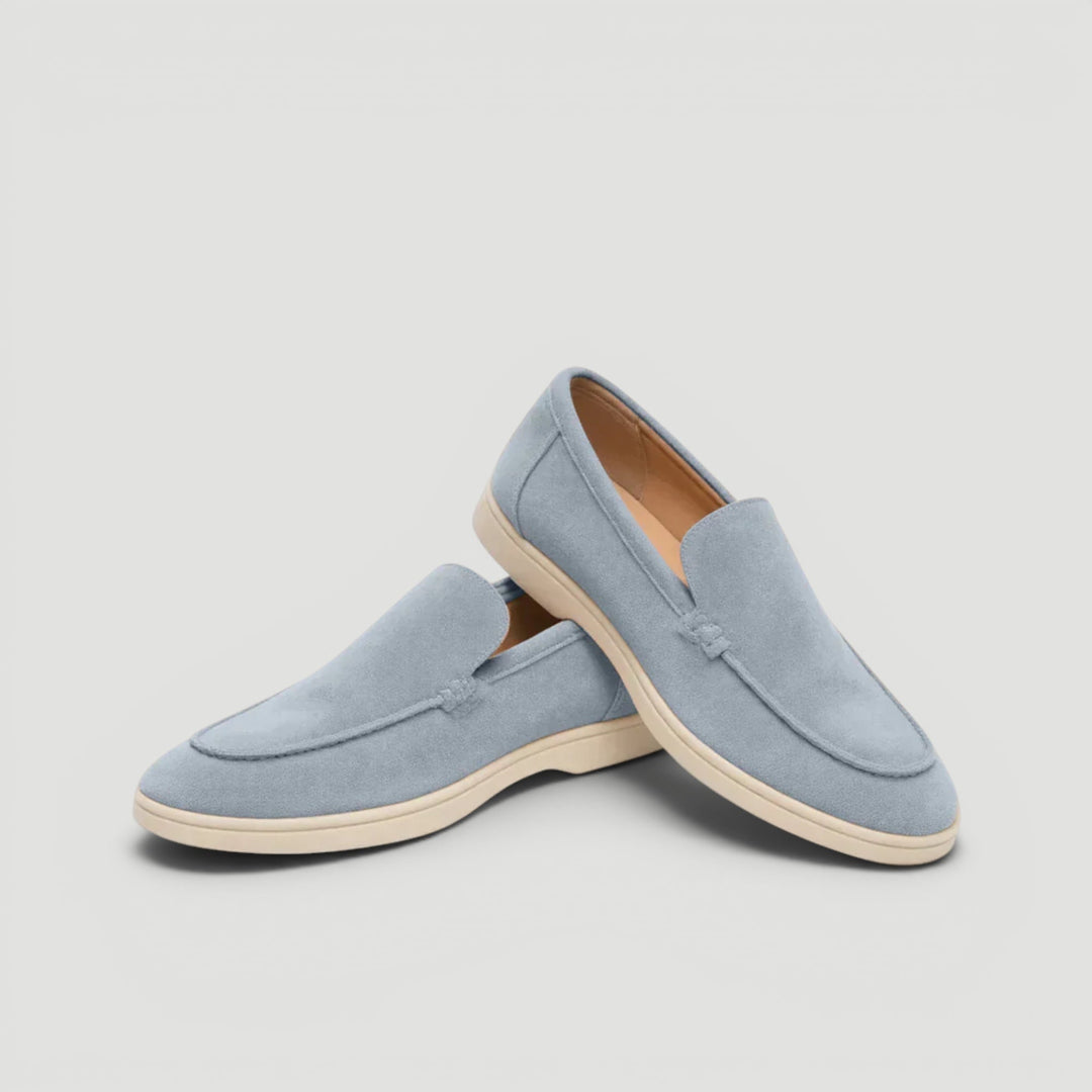 Man wearing stylish slip-on loafers enjoying a summer day, comfortable & elegant mens fashion footwear.