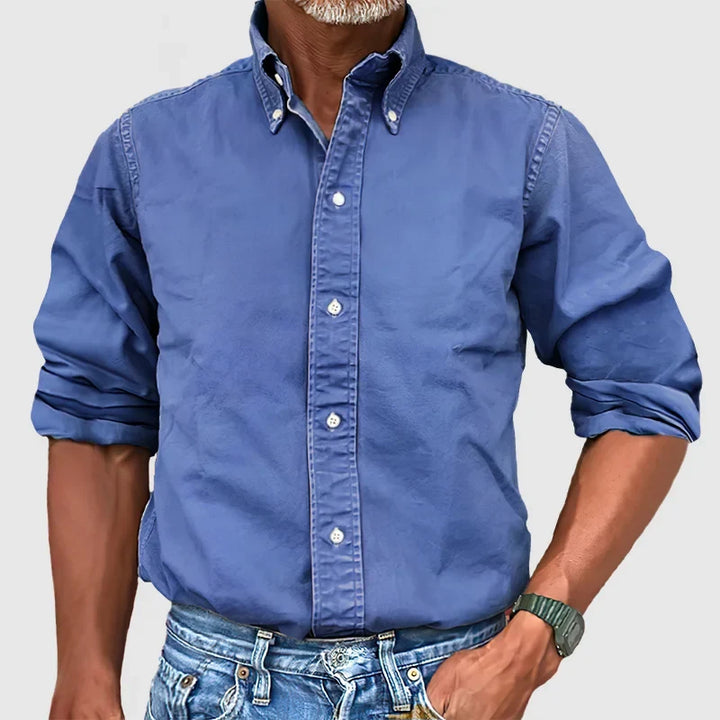 Classic blue men's long-sleeve button-down shirt, a versatile choice for any occasion.