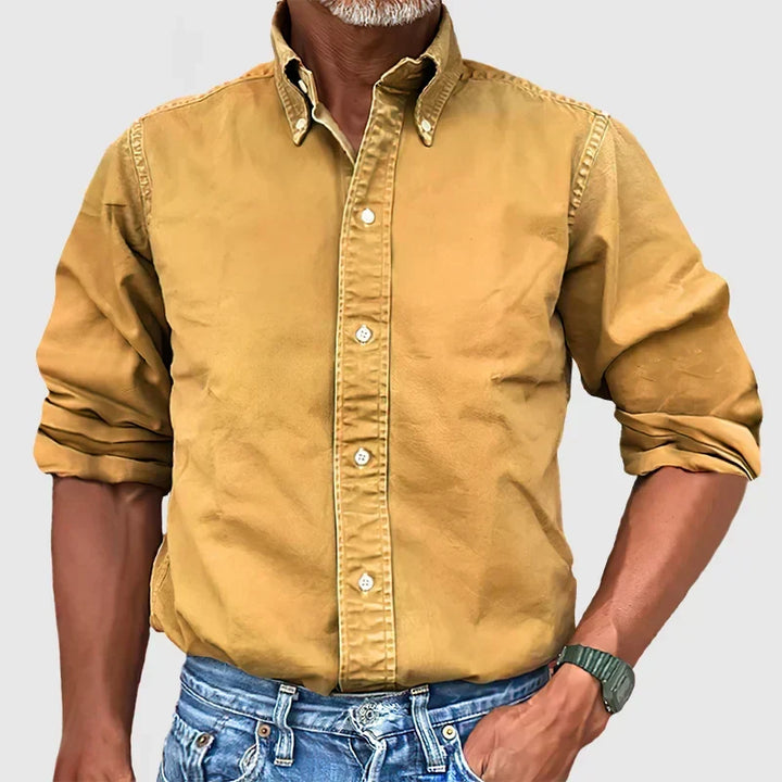 Crisp white men's classic long-sleeve shirt, a wardrobe essential for sophisticated styling.