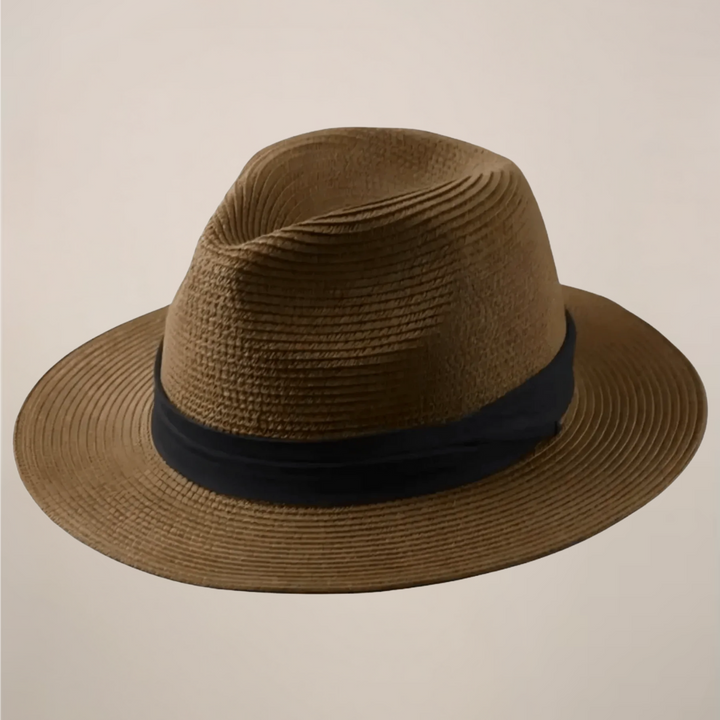 Stylish men's wide-brim Panama hat, an essential lightweight travel accessory for summer vacations.