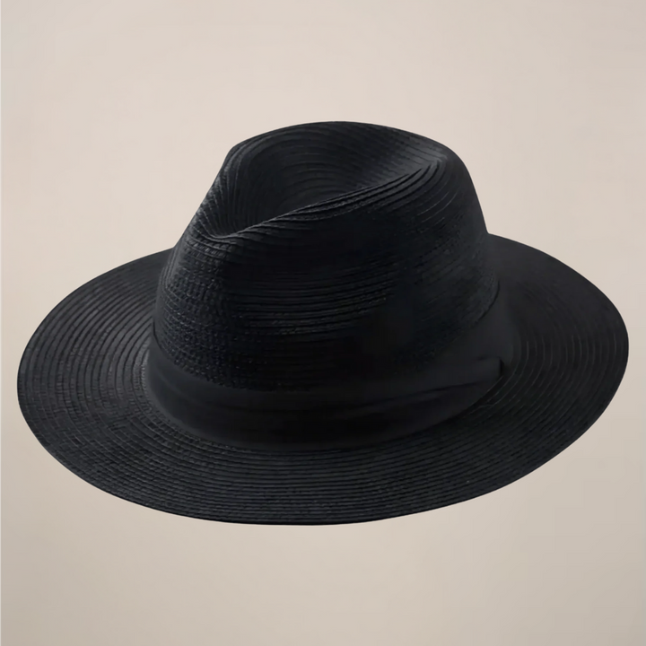 Handwoven straw men's Panama hat, featuring a wide brim for comfortable, classic summer sun protection.