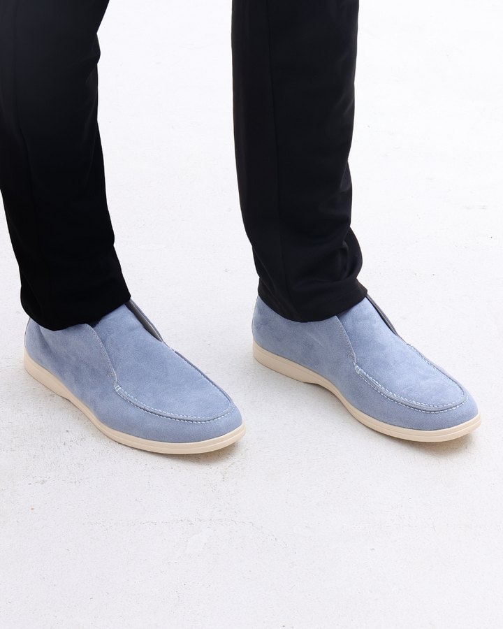 Close-up of classic men's slip-on loafers, highlighting the quality craftsmanship and comfortable, sleek design.