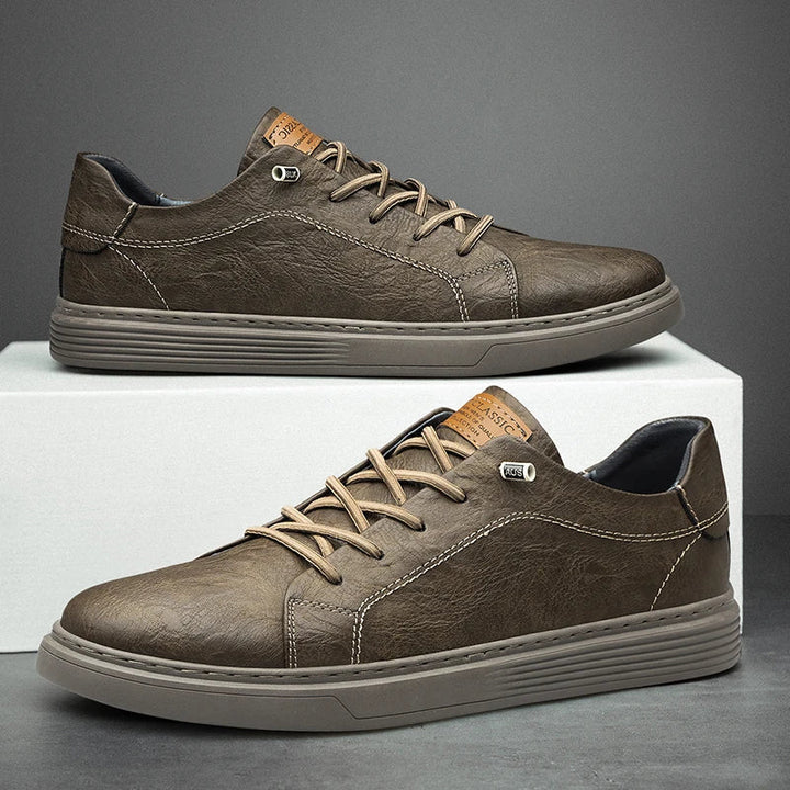 Classic men's white sneakers with comfortable design, durable for all-day wear. Essential everyday casual footwear.