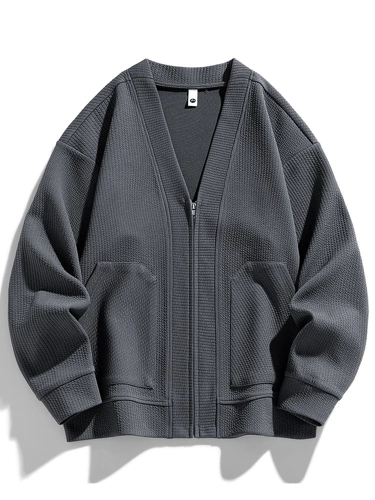 Warm men's full-zip cardigan sweater in a comfortable stretch knit for casual winter wear.