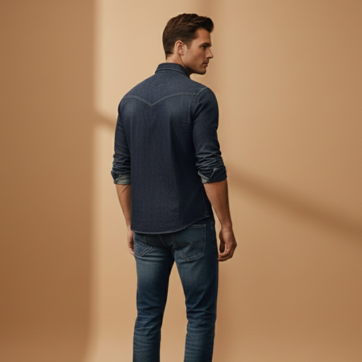 Men's denim button-up shirt featuring twin chest pockets, ideal for a classic, stylish casual look.