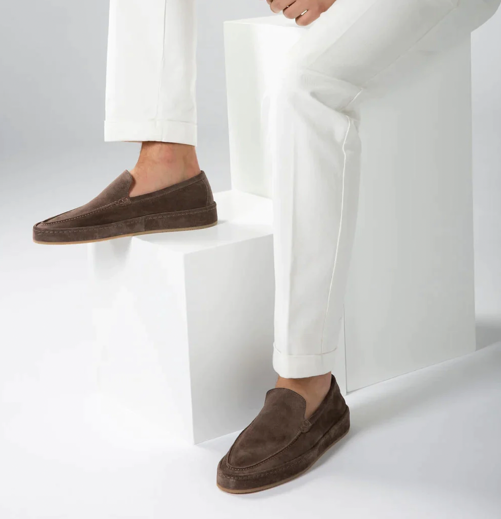Stylish men's navy blue loafers, elegant slip-on shoes for smart casual attire.